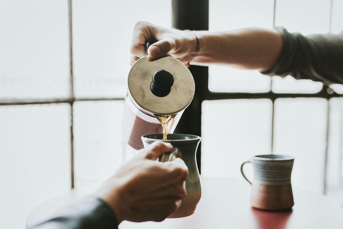 man-pouring-coffee