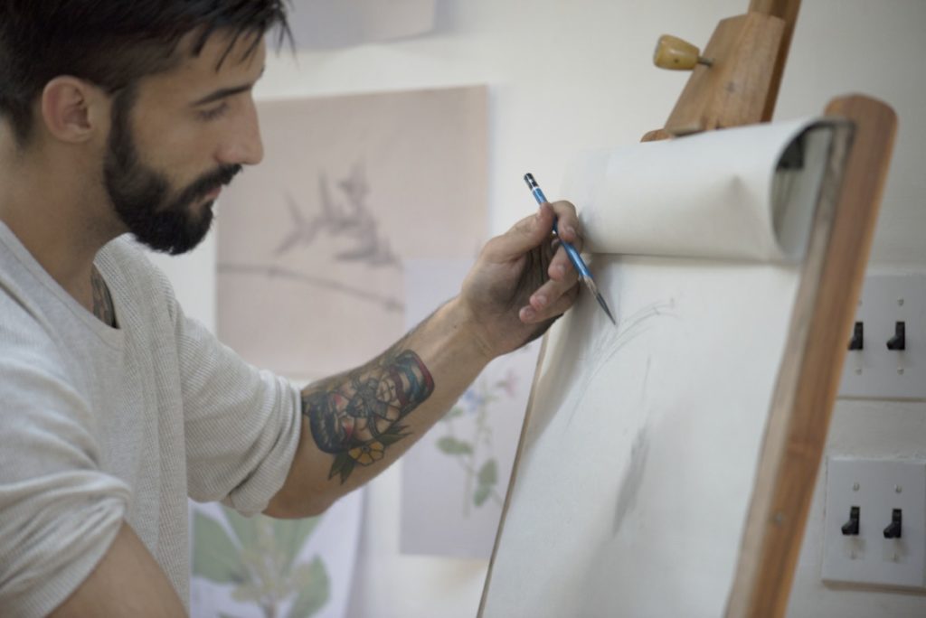 young man with a mental health disorder doing self treatment art therapy