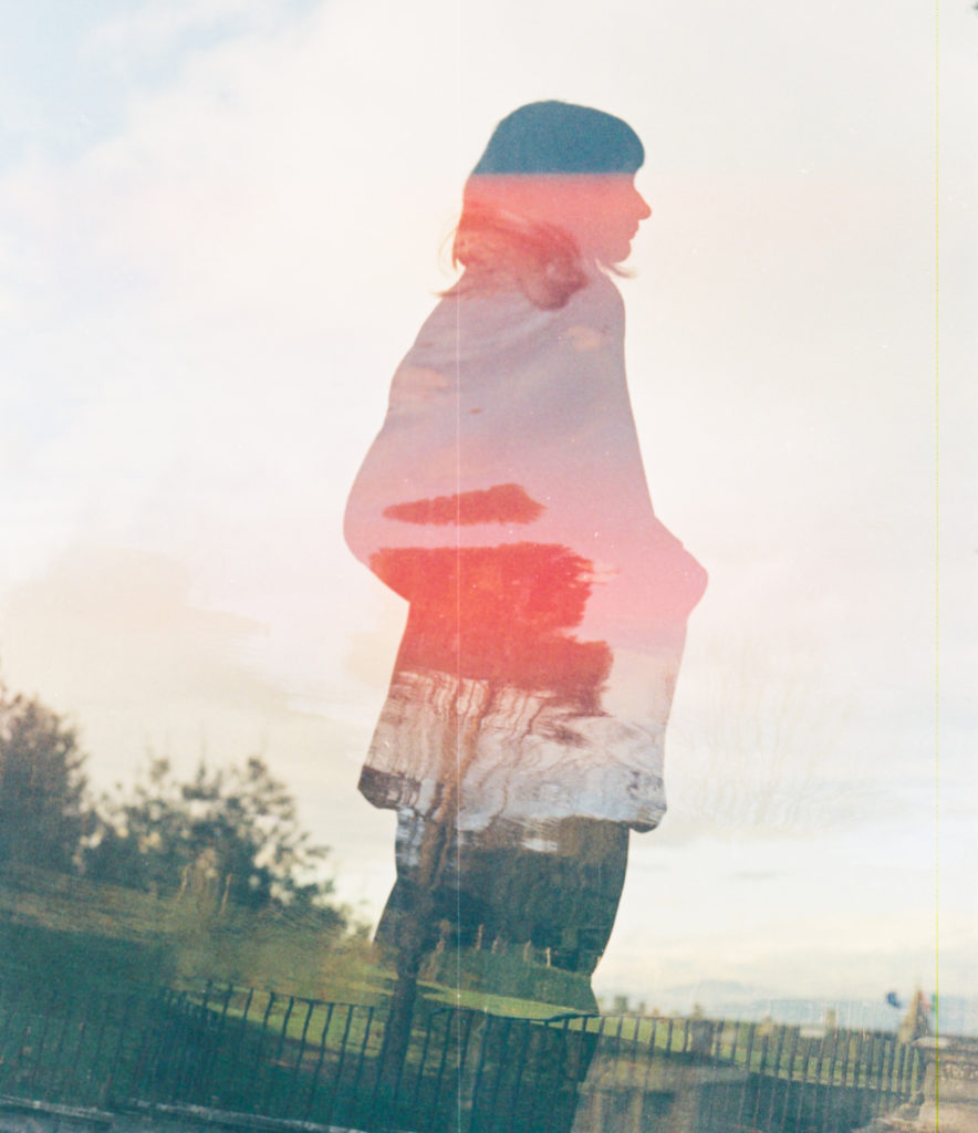 silhouette of woman with an overlayed blurry image