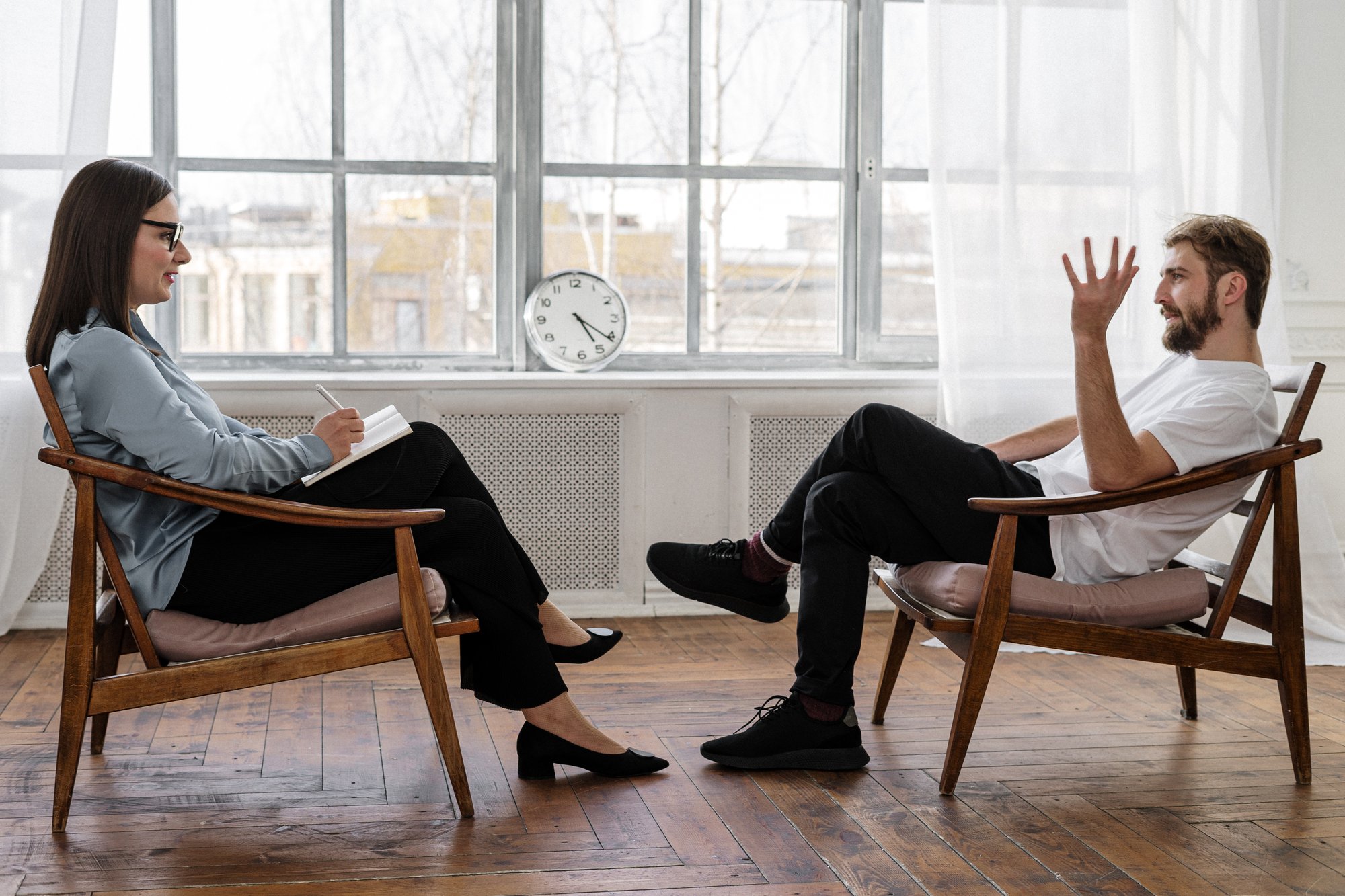 one on one therapy session A licensed mental health professional using talk therapy in therapy sessions
