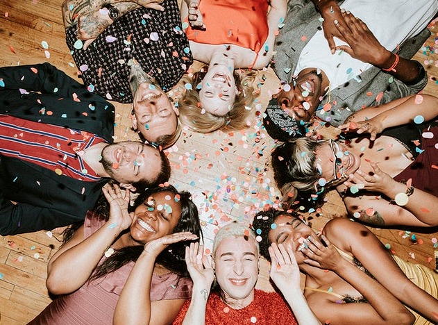 Group of friends lying on the floor at a party