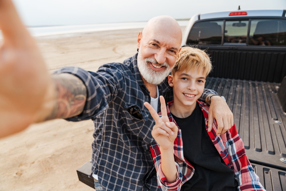 A once active duty military father with son on the beach.