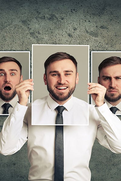 man showing cards of different personalities