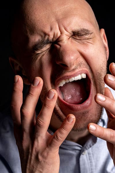 Adult man shouting and suffering from mental health issues