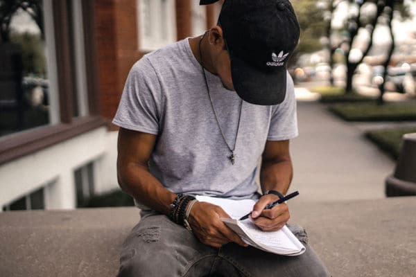 Young man journaling to help with his mental health
