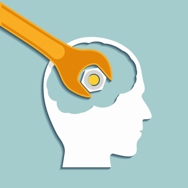Human head and a wrench Hand reaching out for help concept image for mental health and other issues in adolescents, adults, and older adults